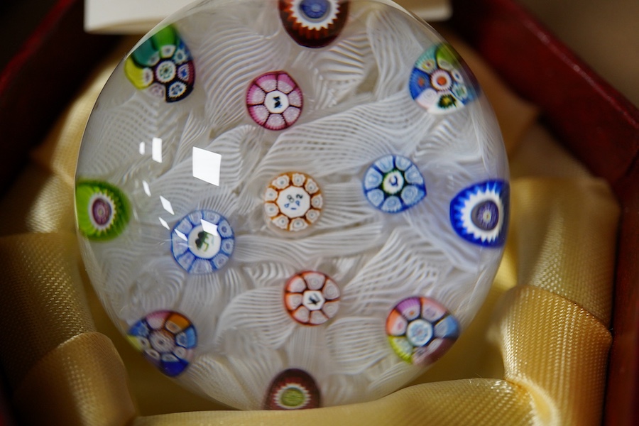 Two Perthshire glass Christmas paperweights for 1981 and 1983, a Perthshire miniature Latticino weight, 18/400, dated 1982, and a Selkirk glass Millefiori crown paperweight, 1982, (4) Largest Perthshire paperweight 8cm